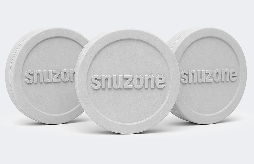 Three white Snuzone-branded tins from the Member Club banner